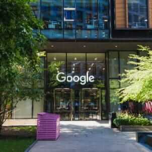 a building with glass windows and a google sign